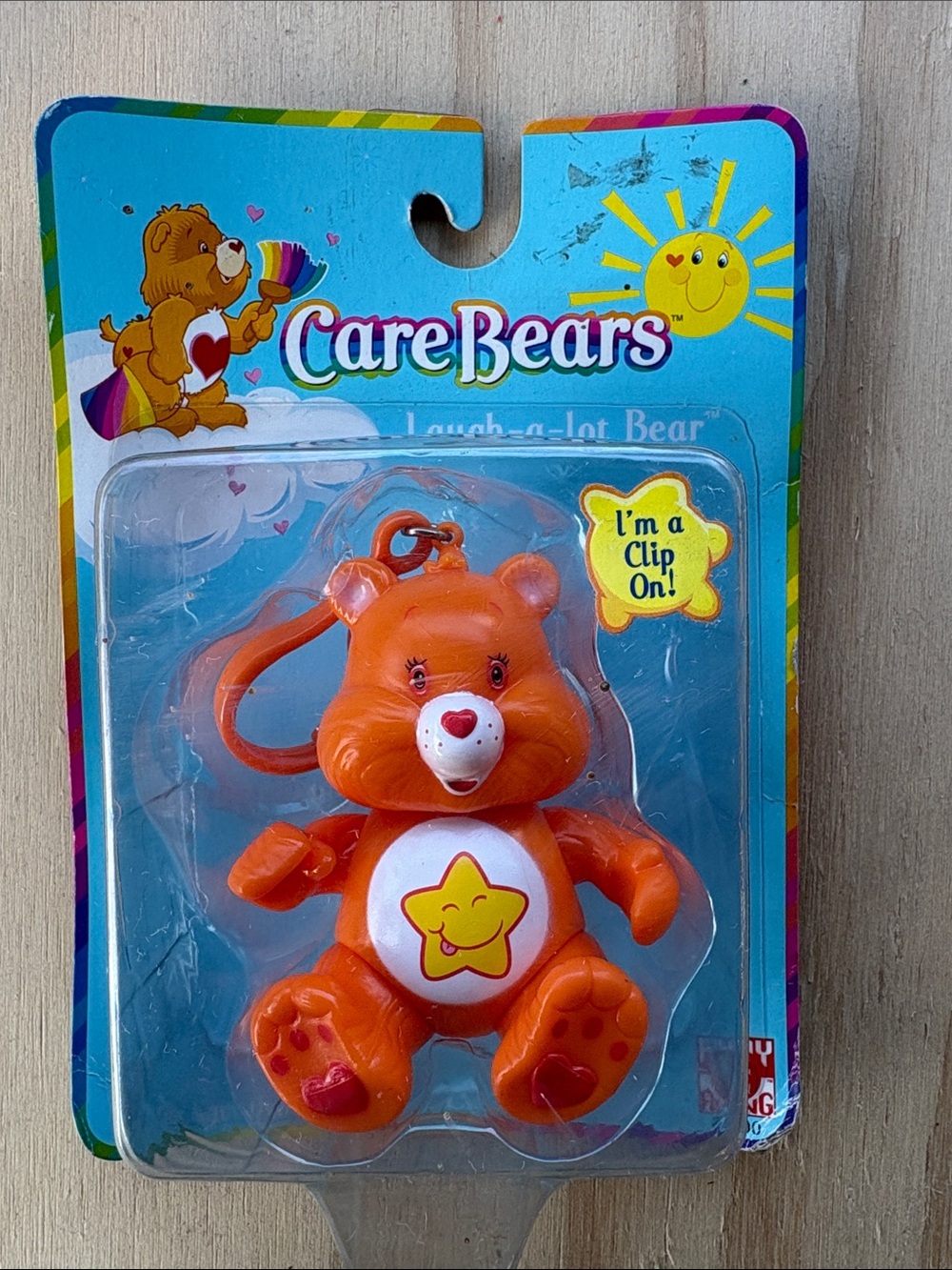 Care Bears Laugh-a-Lot Bear Orange Clip-On Keychain
